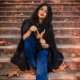 lovely-young-woman-wears-knitted-scarf-black-dress-sitting-stairs-autumn-park (2)